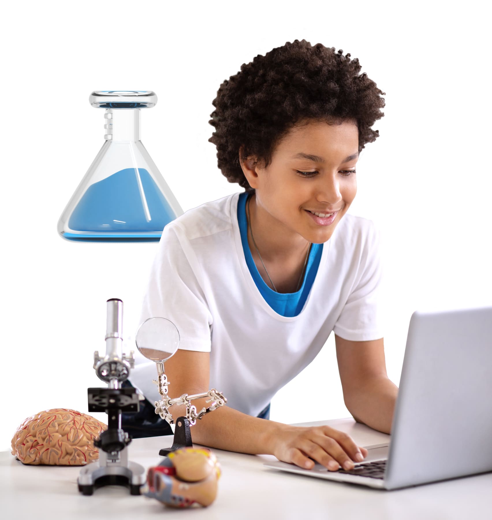 A young boy focused on his laptop, engaged in an activity, showcasing modern technology use in a casual setting.