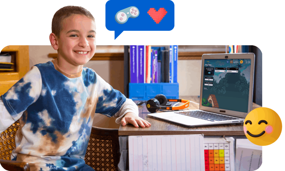 A boy sitting at a desk, smiling while using a laptop, creating a cheerful and engaging atmosphere.