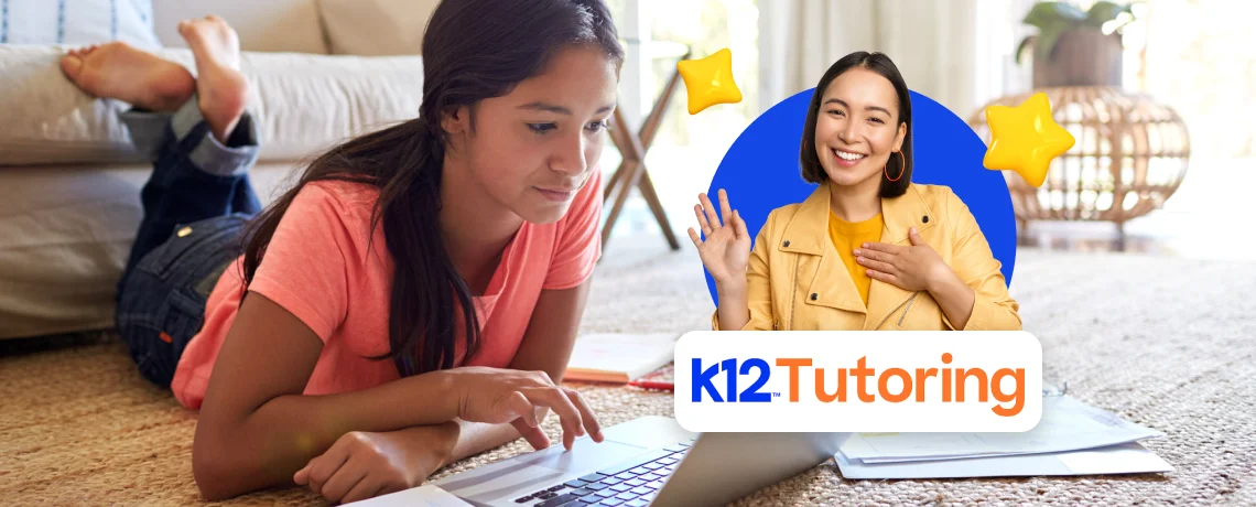 Young girl in a pink shirt lying on the floor using a laptop, with an overlay of a smiling tutor wearing a yellow jacket waving. "K12 Tutoring" text included.
